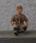 WWII German Toy Seated Soldier 